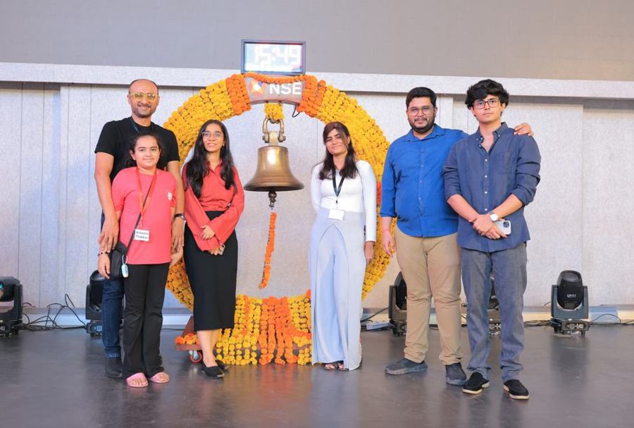 Speakers and attendees at the NSE bell